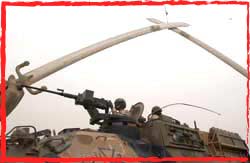 SECDET ASLAV under Saddam's Victory Arch Baghdad 2003