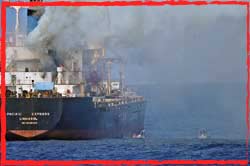 A cargo vessel burns in the Gulf of Aden after a Somali pirate attack.