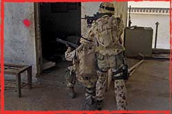 Clearance Diving Team 3 operators conduct a room to room clearance of Umm Qasr port in Iraq March 2003.