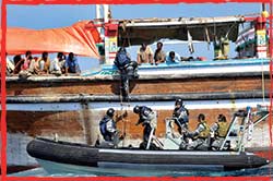 HMAS Anzac's Ships Boarding Party conduct a flag verification on a fishing dhow in the Gulf of Aden