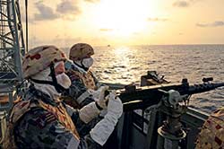 HMAS Toowoomba pussers provide overwatch during Boarding VBSS Ops off Africa.