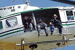 Australian Federal Police Armed Special Tactics Group sniper team provides overwatch during the April 2006 Honiara riots