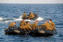 2 Commando Regt operators form up in Wewak Harbour PNG after a Parachute Load Follow jump from RAAF C-130J Hercules.
