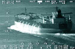 HMAS Darwin comes to the rescue of a tanker under pirate attack in the Gulf of Oman