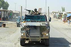 A 205 Corps Advisory Team Bushmaster during an outside the wire Key Leadership Engagement operation in Kandahar in June 14