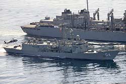 HMAS Darwin refuels from a US Navy replenishment ship in the Middle East during her 2014 tour