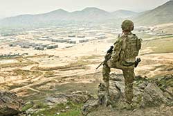 An ANAOA Force Protection Platoon Digger looks over the ANA Officer Academy at Qargha near Kabul