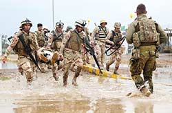 An Australian Task Force Taji Training Team soldier works with Iraqi Army Jundies at Taji Military Complex north of Baghdad.